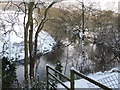 The snow covered banks of the River Derwent in DE4 2EH