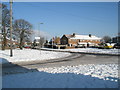 Junction of Park House Farm Way and a snowy Middle Park Way in PO9 4RT