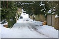 Snow covered Assarts Road in WR14 4HD