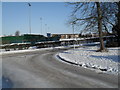 A snowy pavement at the junction of Redwood Grove and Martin Road in PO9 2LE