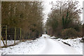 Snow-covered lane to Frankton Grounds near the fishponds in CV23 8ET