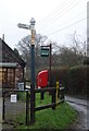 Road Sign & post box outside Bicknoller shop, Bicknoller in TA4 4EN