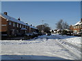 Junction of a snowy Abbotstone Avenue and Swarraton Road in PO9 2LE