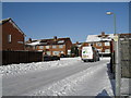 Looking along a snowy Swarraton Road towards Abbotstone Avenue in PO9 2LE