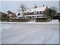 A snowy scene at the junction of Dysart Avenue and Lower Drayton Lane in PO6 1HG