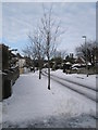 Mid section of a snowy East Cosham Road in PO6 2DS