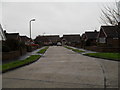 Looking from the junction with Kirkland Close to the far end of Parry Drive in BN17 6ST
