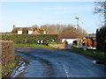 Sharp bend in Goldwell Lane and Woodleas Farm in TN25 7DX