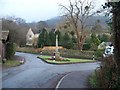 Road junction and war memorial in GL52 3NT