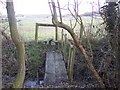 Footbridge and stile in Mayshaves Wood in TN26 3PT