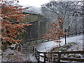 Dell Road as it passes under Spodden Viaduct in OL12 0TF