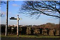 Signpost on the A523 in Poynton West and Adlington Ward