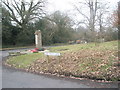Looking from Old Kiln Lane across the war memorial towards the A287 in GU10 2NS