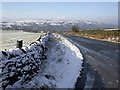 Looking West from a snowy Otley Chevin in LS21 3DQ