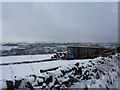 Farm sheds in the snow in SK17 7RR