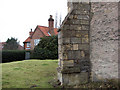 Holme: buttress and pantiled house in NG23 7RY