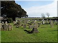 A verdant churchyard at St George's, Eastergate in PO20 3RS
