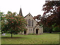St John's, West Byfleet, with pink horse chestnut tree in KT14 6RJ