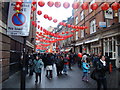 View down Lisle Street from the junction of Newport Street in SW1Y 5AH