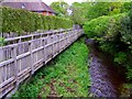 Footpath and stream parallel to Brookside Road, Brockenhurst in SO42 7UR