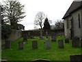 Simple crosses in the churchyard at St James, Stedham in GU29 0NG
