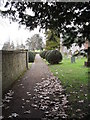 Looking along the churchyard path towards Eastshaw Lane in GU29 9RR