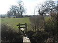 Stile on High Weald Landscape Trail near Dumbourne Farm in TN30 7ND
