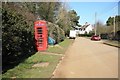 Rowston telephone kiosk and village view in Rowston