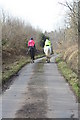 Riders on the road between Counterland Copse and Side Downs in EX5 3DH