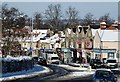 Shops on Wokingham Road after snowfall in RG6 1JS