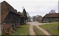 Footpath south through Mitchell Park Farm in GU28 9LA