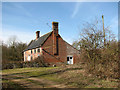 Track past the farmhouse at Wood Farm in South Norfolk District