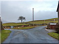Road junction east of Cark in LA11 7NT