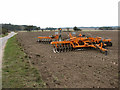 Disc harrow in field north of Illington Road in NR16 2RB