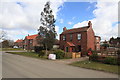 Village Post Box and view of new infill housing, Biggin in LS25 6HJ