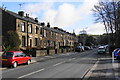 Terraced houses on Huddersfield Road, Newhey in OL16 3RA