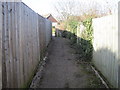 Path between Ledsham Park and Hollinghurst Close in TN37 7PB