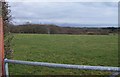 Pasture land crossed by power lines south of Penbryn in Llanystumdwy Community