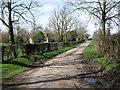 Rectory Road past Manor Farm, Topcroft in NR35 2BT