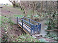 Private footbridge over stream in RH13 6LH