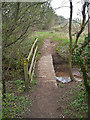 Footbridge over a stream. in CV8 1TJ