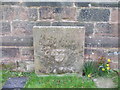 Stone "notice-board", St Peter's Church, Broughton in ST21 6NS