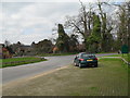 Looking from the access road to the Cowdray Farm Shop towards the Midhurst Road at Easebourne in GU29 9AG
