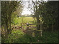 Stile on a path towards Combwell Priory Farm in TN5 7QG