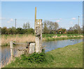 Footpath marker beside Well Creek in PE38 0BE
