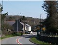 View east along the winding A497 at Pentrefelin in LL52 0PE