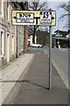 An old style road sign at Langholm in DG13 0DZ