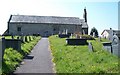Path leading to the north door of Eglwys St Cawrdaf in LL53 6BF
