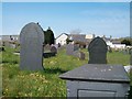 View west across the old churchyard at Eglwys St Cawrdaf in LL53 6BF