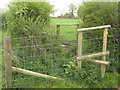 Stiles near Bircholt Court in TN25 5NA